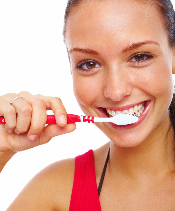 woman brushing teeth