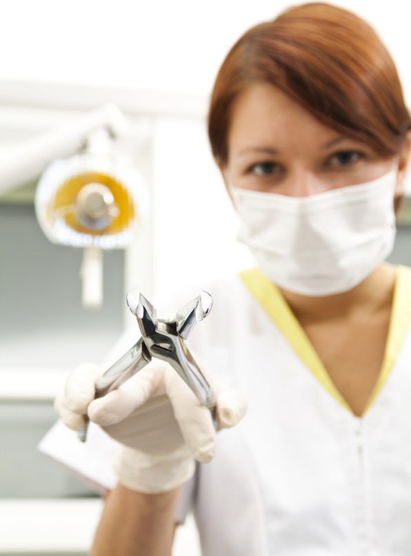 Portrait of a dentist in exam room