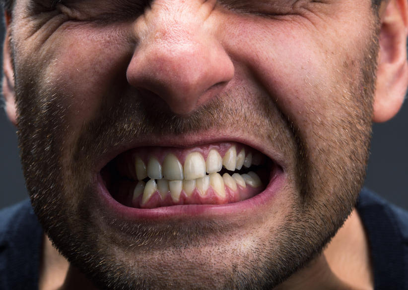 Closeup of mouth of very stressed man