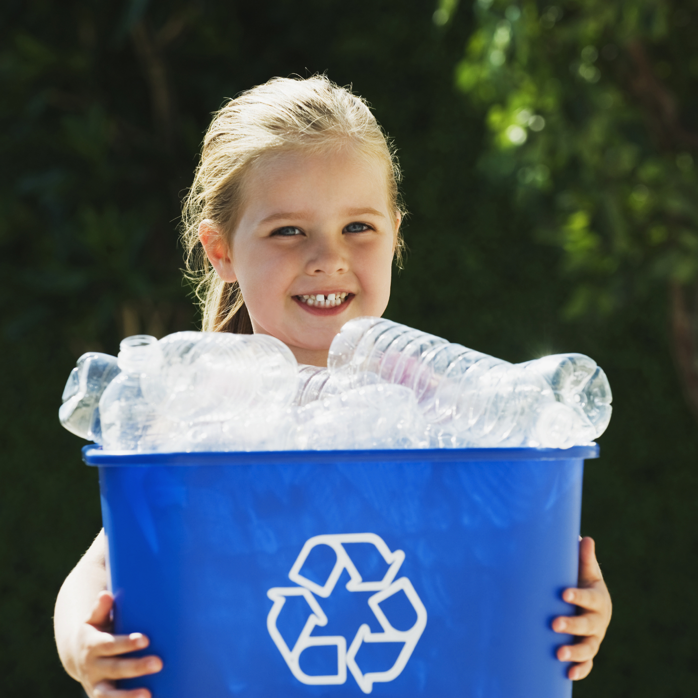 Little Girl Holding Recycling Bin
